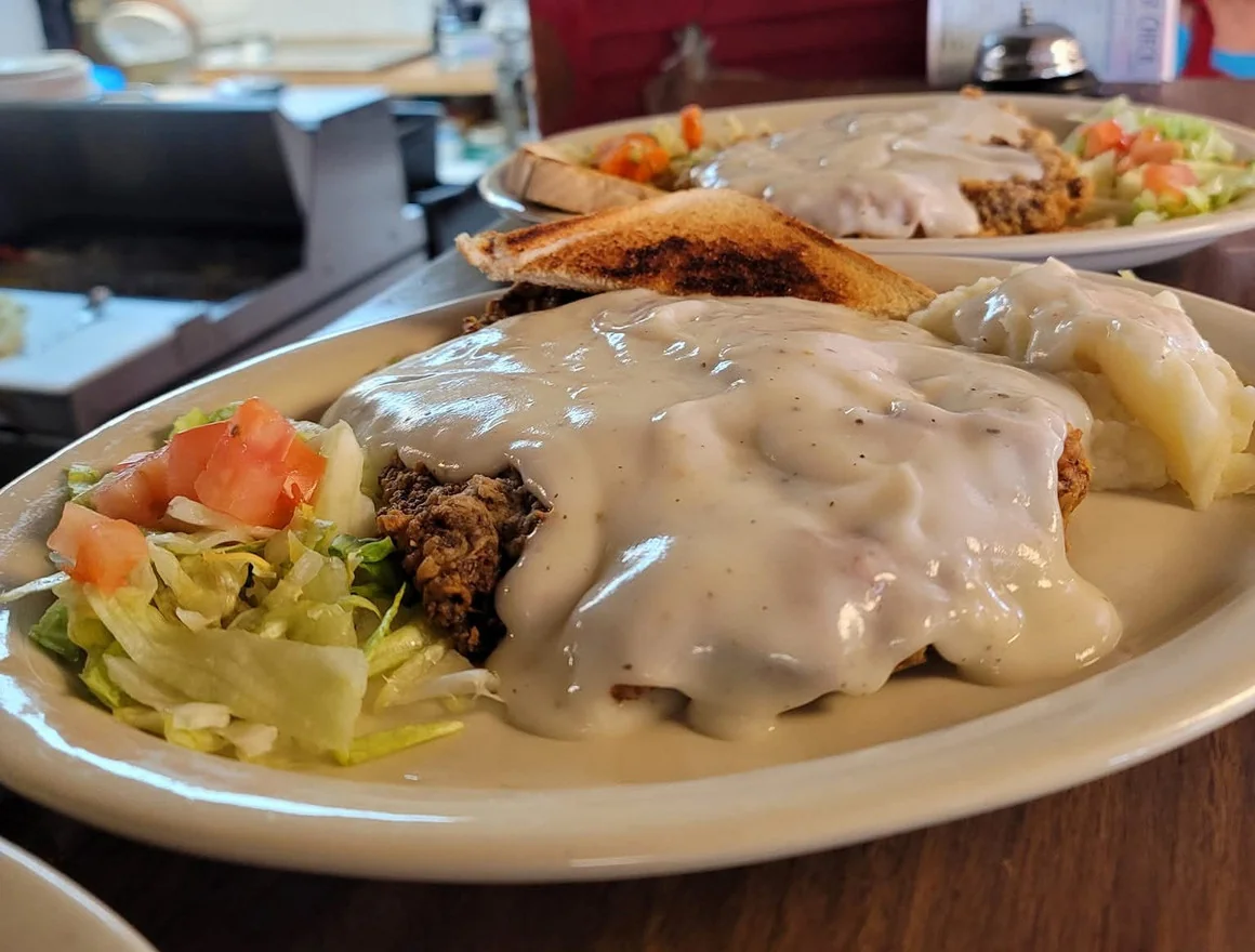 Chicken Fried Steak - Golden, crispy chicken fried steak smothered in our homemade gravy — a customer favorite.