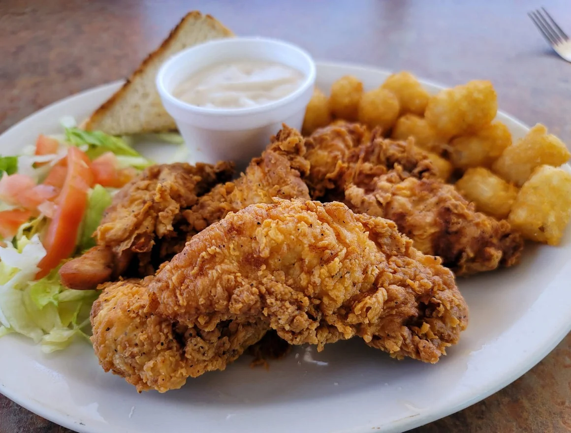 Chicken Strip Plate - Hand-breaded chicken strips served with your choice of sides.
