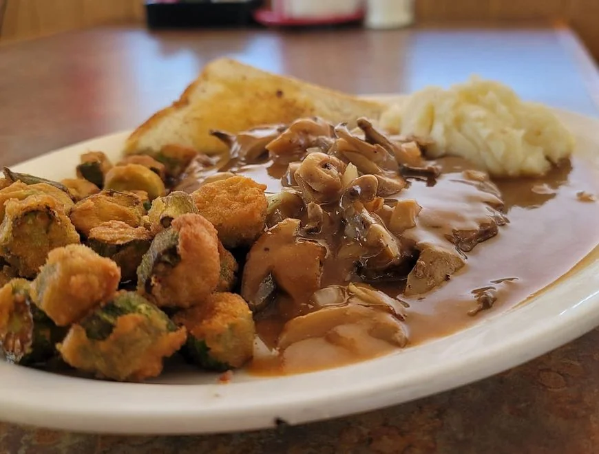 Hamburger Steak - Tender hamburger steak smothered in savory gravy and onions.