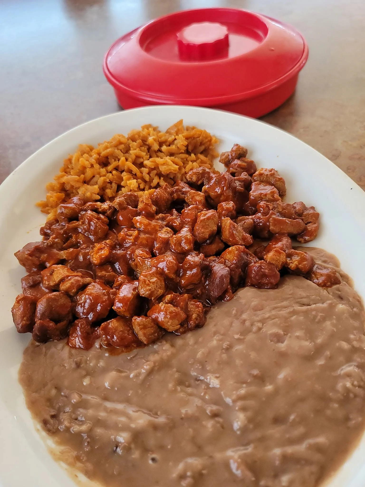 Asado Plate - Slow-cooked asado plate with traditional Tex-Mex sides.